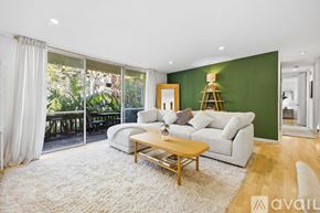 San Diego condo for rent - A pool surrounded by a fence and a green canopy.