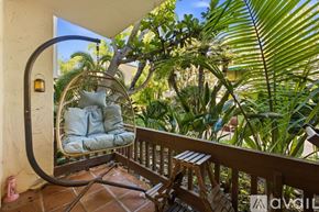 San Diego condo for rent - A bedroom with a large bed and a wooden door.