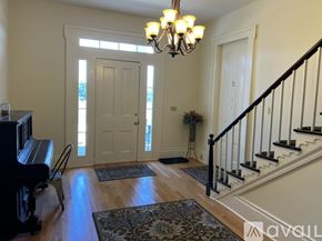 Brownsville apartment for rent - A living room with a piano and a staircase.
