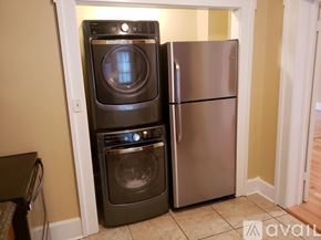 Brownsville apartment for rent - A black dishwasher and a black oven are stacked on top of each other.