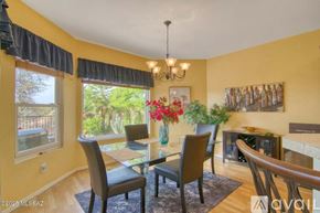 Oro Valley townhouse for rent - A dining room with a glass table and chairs.