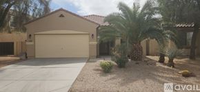 Maricopa house for rent - A house with a garage and a driveway in front of it.