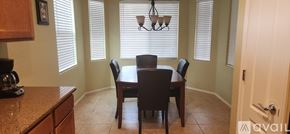 Maricopa house for rent - A dining room with a table and chairs.