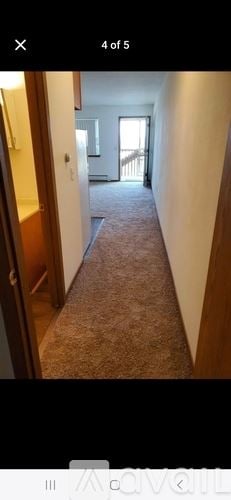 Waterloo house for rent - A long hallway with a carpeted floor and white walls.
