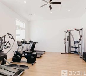 Lehi apartment for rent - A gym with treadmills, elliptical machines, and a weight machine.