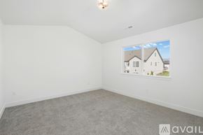 Lehi townhouse for rent - A room with a carpeted floor and a picture of a house on the wall.