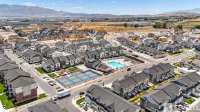 Lehi townhouse for rent - A large residential area with a swimming pool and a road.