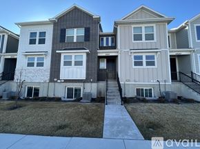 Lehi apartment for rent - A row of houses with the first one on the left being a two story building and the others being one story.