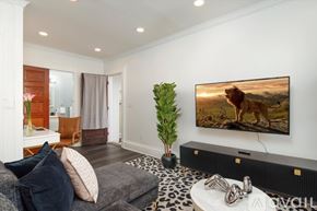 Oneonta apartment for rent - A living room with a large flat screen TV mounted on the wall.