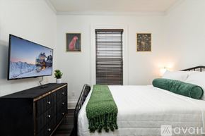 Oneonta apartment for rent - A bedroom with a bed, a dresser, and a television.