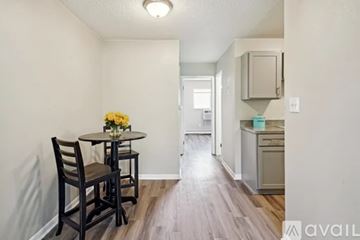 Colorado Springs apartment for rent - A dining area with a table and chairs is shown.