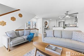 Imperial Beach condo for rent - A street view of a beachfront with palm trees and the ocean in the background.