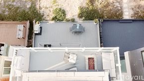 Huntington Beach apartment for rent - A modern house with a flat roof and a grey exterior.
