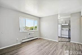 Colorado Springs apartment for rent - A room with a window and a washing machine.