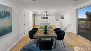 West Hollywood apartment for rent - A modern dining room with a large table and chairs.