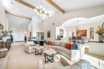 La Quinta house for rent - A living room with a white couch and a coffee table.