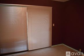 Susanville house for rent - A room with a pair of closed blinds on the window.