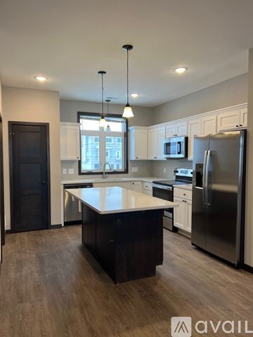 North Mankato apartment for rent - A modern kitchen with a large island in the middle.