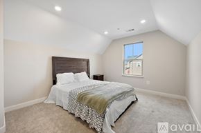 Frederick townhouse for rent - A kitchen with white cabinets and a large island.