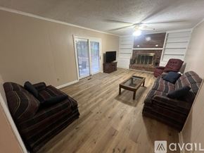 Carmel house for rent - A living room with a fireplace and a television.