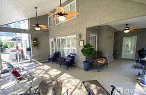 Gulf Shores apartment for rent - A sunny day in a spacious patio with a table and chairs.