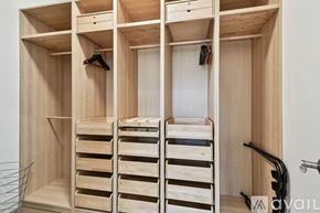 Land O' Lakes house for rent - A wooden wardrobe with a mirror and hanging space.