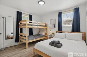 Dallas house for rent - A bedroom with a large bed and a bunk bed.