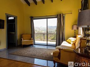 Salinas house for rent - A bedroom with a large bed and a view of the city.