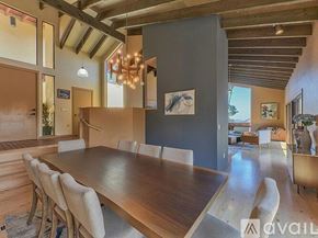 Salinas house for rent - A dining room with a long table and chairs.