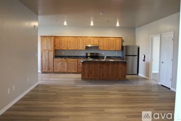 Twin Falls apartment for rent - A kitchen with wooden cabinets and a wooden floor.
