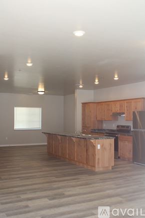 Twin Falls apartment for rent - A grey building with a white door and windows.