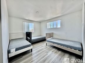 Los Angeles house for rent - A rooftop with a solar panel and a city skyline in the distance.