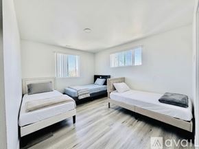 Los Angeles house for rent - A bedroom with two beds and a window.
