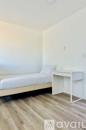 Los Angeles house for rent - A modern house with a white garage door and a blue wall.