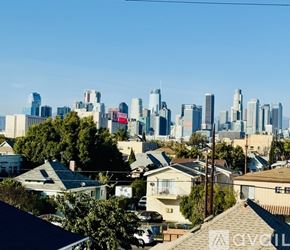 Los Angeles house for rent - A kitchen with a refrigerator, stove, and sink.