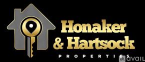 Crown Point apartment for rent - A logo for Honaker & Hartsock properties featuring a key in a house shape.