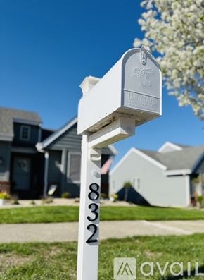 Crown Point apartment for rent - A white US Mail mailbox with the number 832 on it.