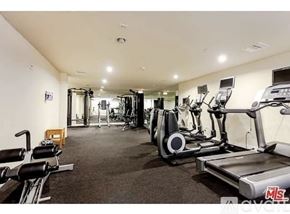 Los Angeles condo for rent - A well-lit gym with treadmills, elliptical machines, and other cardio equipment.
