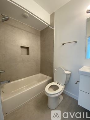 Philadelphia apartment for rent - A bathroom with a toilet, tub, and towel rack.