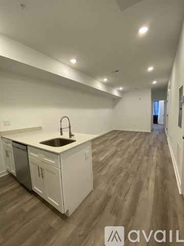 Philadelphia apartment for rent - A kitchen with white cabinets and a sink is available for rent.
