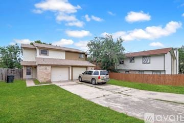 Killeen house for rent - A kitchen with wooden cabinets and a tiled floor.
