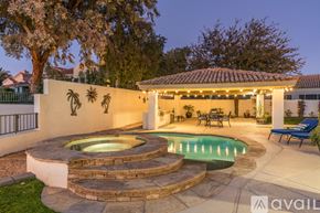 Scottsdale house for rent - A house with a pool and a patio area.