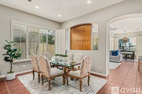 Scottsdale house for rent - A dining room with a glass table and chairs.