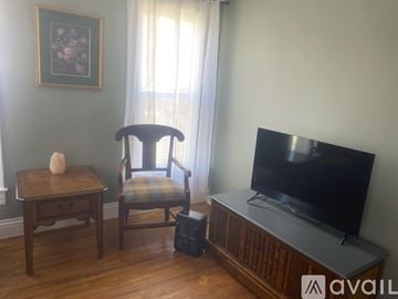 Springfield apartment for rent - A chair sits in front of a television in a living room.
