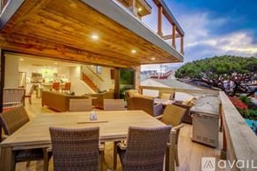 San Diego house for rent - A modern house with a balcony and a hot tub.