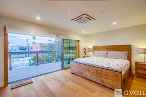 San Diego house for rent - A modern kitchen with stainless steel appliances and wooden floors.