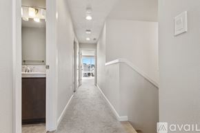 Hillsboro townhouse for rent - A room with a window and a view of buildings outside.