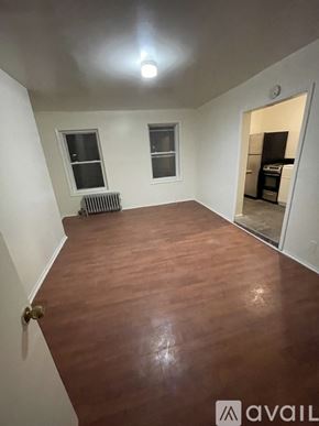 Brooklyn townhouse for rent - A room with wooden flooring and a radiator.