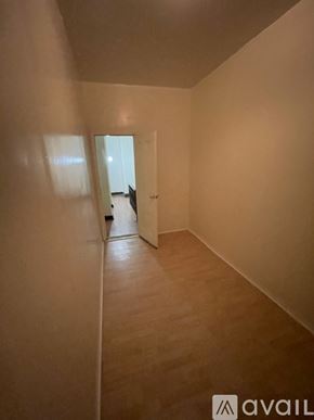 Brooklyn townhouse for rent - A hallway with a cat sitting on the floor.