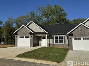 Knoxville townhouse for rent - A two-story house with a garage on the side.